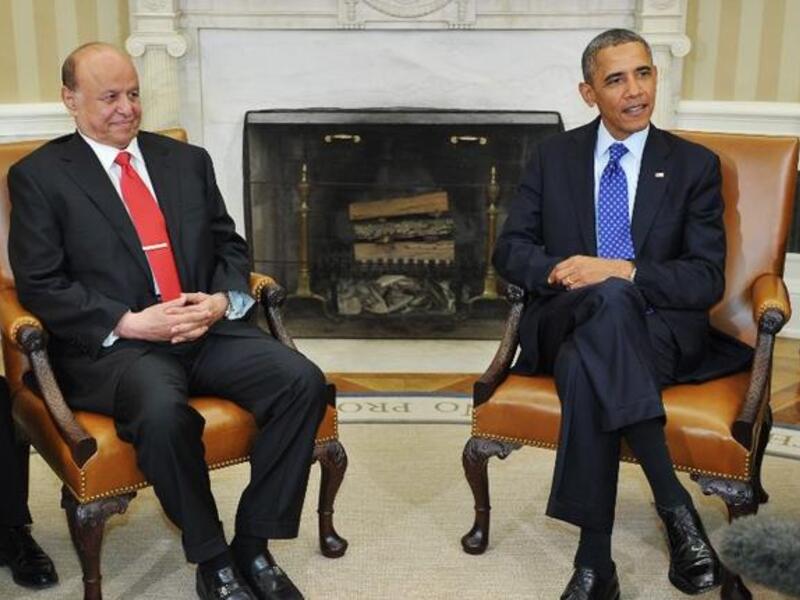 UNITED STATES, Washington : US President Barack Obama and Yemen's President Abdrabuh Mansur (L) are seated as they wait for the press to arrive before they speak in the Oval Office of the White House on August 1, 2013 in Washington, DC.  AFP PHOTO/Mandel NGAN