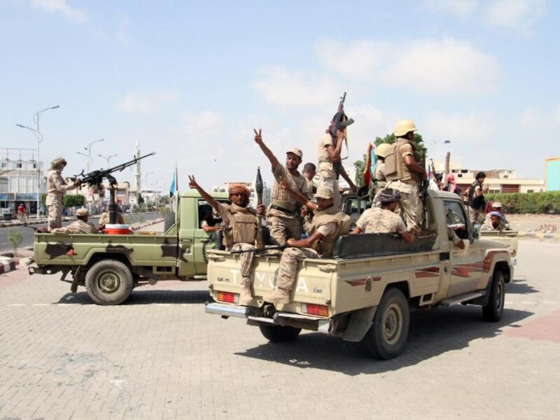 Yemeni fighters from the separatist Southern Movement, loyal to the government forces, arrive for a rally marking the anniversary of the south's revolt against British colonial rule on October 13, 2016, in the southern city of Aden. (AFP/Saleh al-Obeidi)