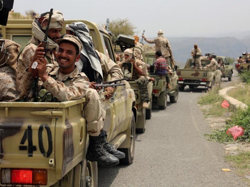 Yemeni fighters loyal to President Abedrabbo Mansour Hadi drive in convoy in the Yafa area some 180 kilometres north of the port city of Aden on August 9, 2016. (AFP/Nabil Hassan)