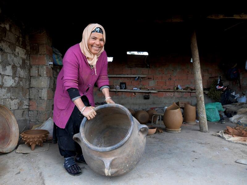 Sabiha Ayari, a Tunisian potter in her fifties, works in the village of Sejnane in the northern Tunisian province of Bizerte, about 120 kilometres (75 miles) west of the capital Tunis.  FETHI BELAID / AFP