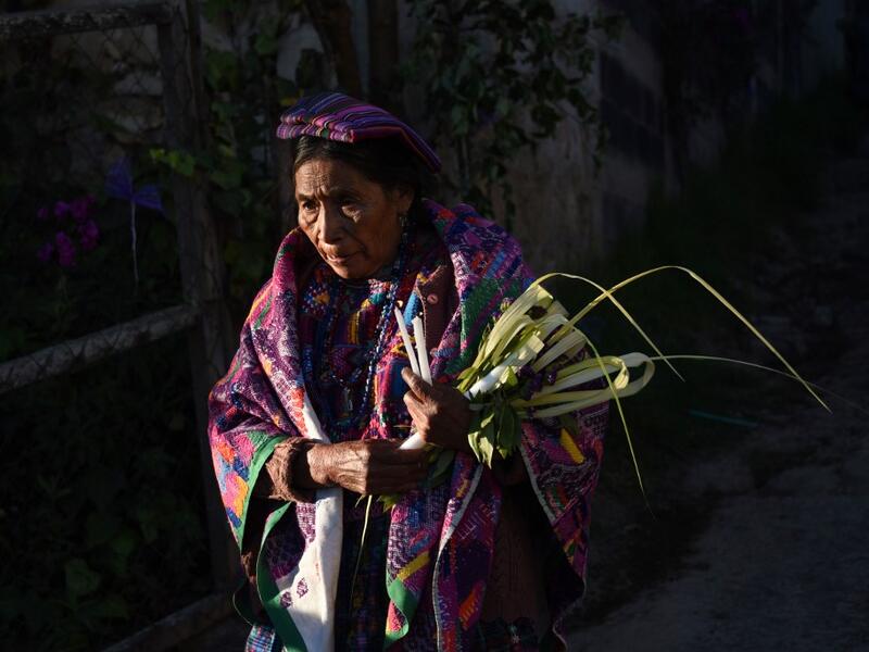 A Catholic faithful takes part the Palm Sunday procession on April 14, 2019 in San Pedro Sacatepequez, 30 km west of Guatemala City.  Johan ORDONEZ / AFP
