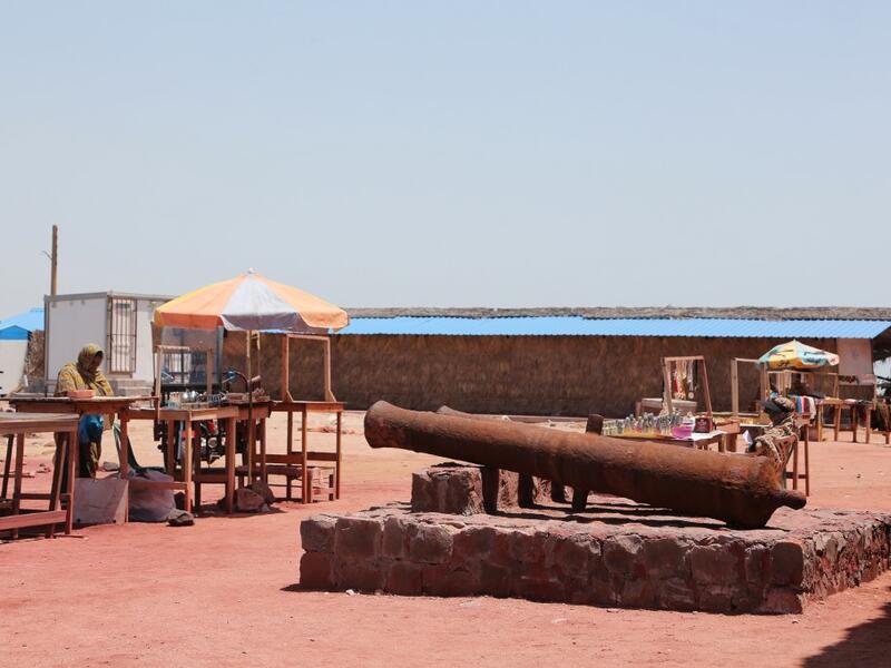 People vist the Fort of Our Lady of the Conception, also known as the Portuguese Castle, the Hormuz Island in the Gulf Strait of Hormuz, off the Iranian port city of Bandar Abbas, on April 29, 2019.  ATTA KENARE / AFP