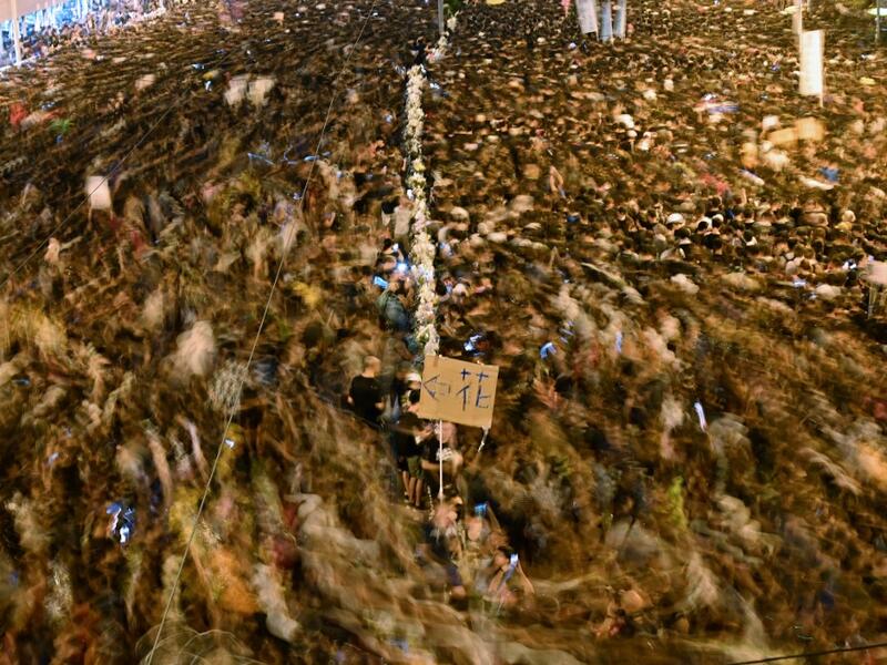 Hundreds of thousands of protesters choked Hong Kong's streets for a second straight on June 16 in a defiant rebuke of a reviled extradition law, piling pressure on the city's embattled pro-Beijing leader despite a weekend climbdown. HECTOR RETAMAL / AFP