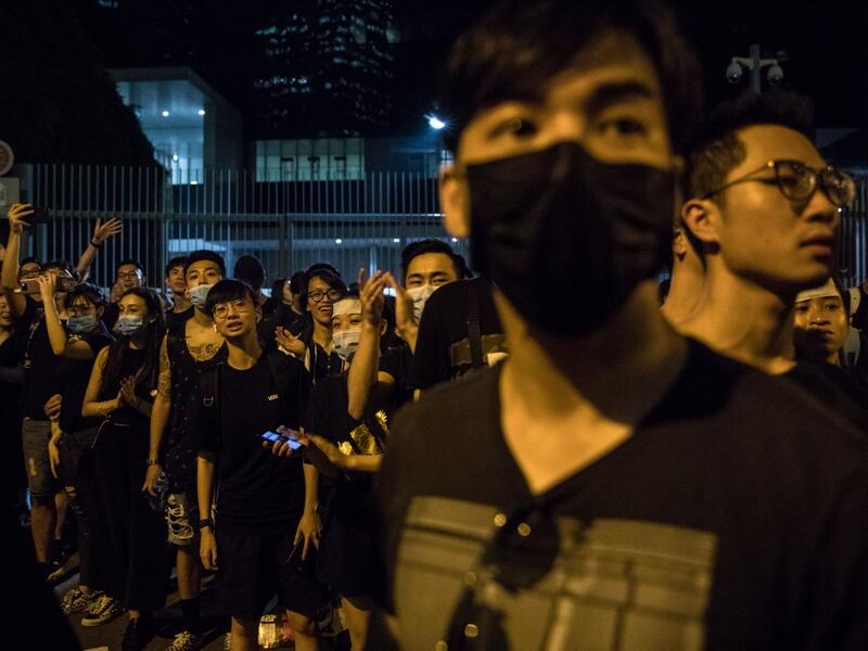 Protesters gather outside the government headquarters after a rally against a controversial extradition law proposal in Hong Kong  DALE DE LA REY / AFP
