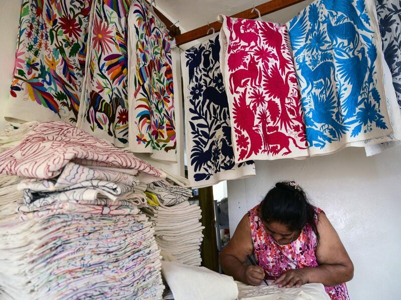 Mexican artisan Glafira Candelaria Jose, of the Otomi ethnic group, works in one of her designs at her workshop in San Nicolas village, in Tenango de Doria, Hidalgo state, Mexico.  Pedro PARDO / AFP