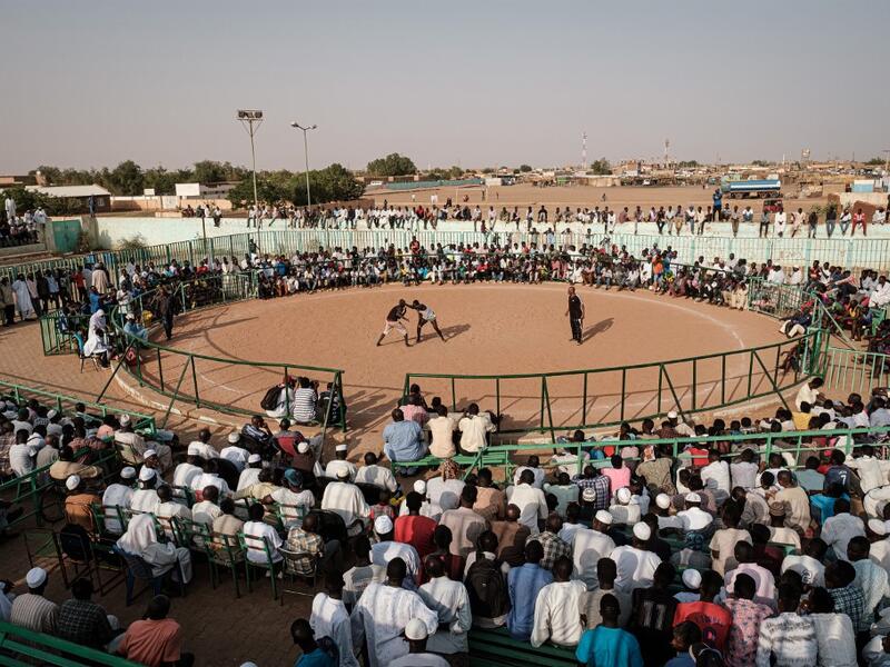 Sudanese wrestlers fight during a traditional Nuba wrestling match at the Haj Youssef stadium in the district of Khartoum.  Yasuyoshi CHIBA / AFP