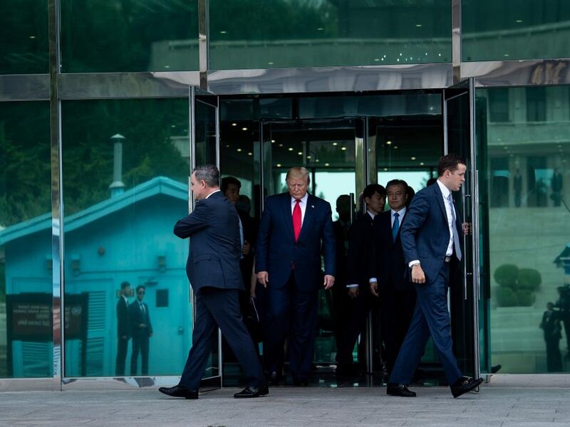 US President Donald Trump leaves Freedom House before walking to the line of demarcation to meet North Korea's leader Kim Jong-un in the Demilitarized Zone(DMZ) on June 30, 2019, in Panmunjom, Korea.  Brendan Smialowski / AFP