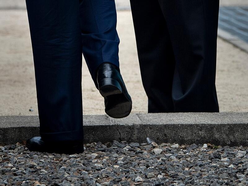 US President Donald Trump steps into North Korea as North Korea's leader Kim Jong-un waits in the Demilitarized Zone (DMZ) on June 30, 2019, in Panmunjom, Korea.  Brendan Smialowski / AFP