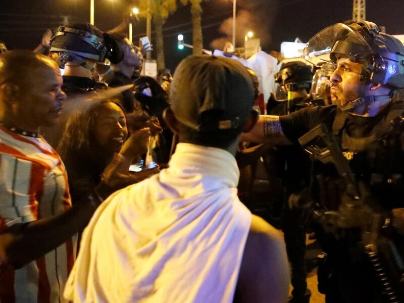  Angry protesters clashed with Israeli police over an off-duty officer's killing of a young man of Ethiopian origin, as the incident drew fresh accusations of racism. JACK GUEZ / AFP