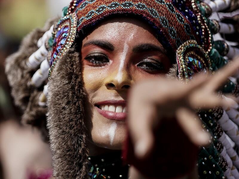 People parade during the Tropical Carnival on July, 7 2019 in Paris.  Kenzo TRIBOUILLARD / AFP