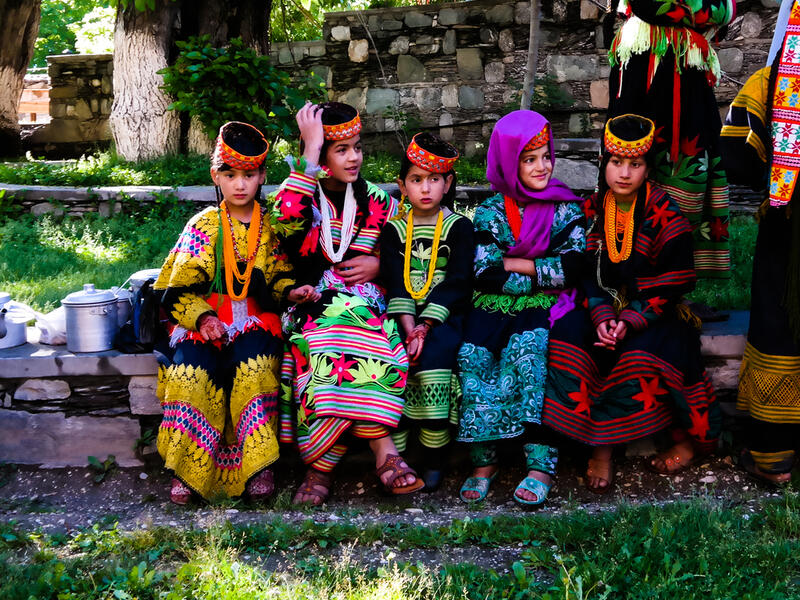 Portrait of Kalash tribe woman in national costume at Joshi fest (Shutterstock)	