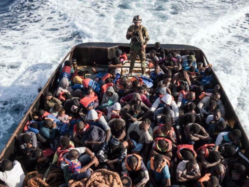 A Libyan coast guard watches over a boat of rescued migrants on  June 27, 2017 /AFP