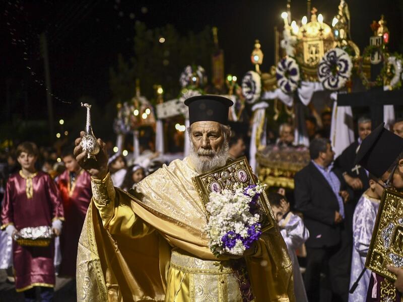 Millions of Greeks flock to churches around the country this week to celebrate Easter, the country's foremost religious celebration. ARIS MESSINIS / AFP