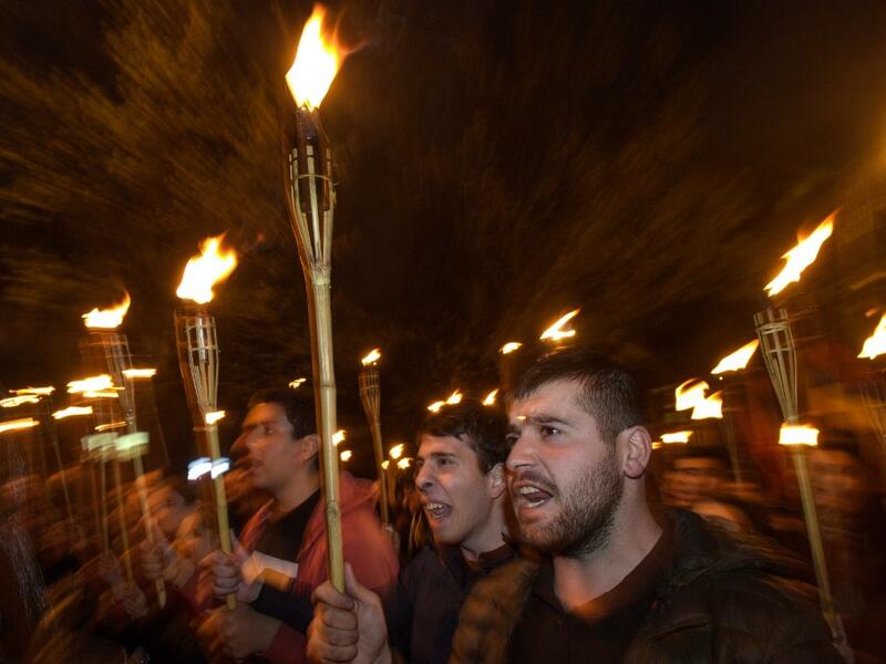 Armenians commemorate on April 24, the 104th anniversary of the killing of 1.5 million by Ottoman forces, as a fierce dispute still rages with Turkey over Ankara's refusal to recognise the mass murder as genocide.  KAREN MINASYAN / AFP