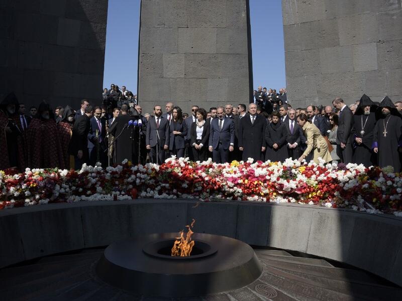 Armenian President Armen Sarkisian, Prime Minister Nikol Pashinyan, Catholicos Garegin II, the head of the Armenian Apostolic Church, and other officials attend a ceremony commemorating the 104th anniversary of the massacre of 1.5 million of Armenians by Ottoman forces in 1915. KAREN MINASYAN / AFP