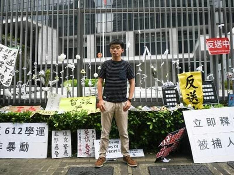 Hong Kong democracy activist Joshua Wong poses during an interview with AFP outside the government headquarters. (AFP/Anthony Wallace)
