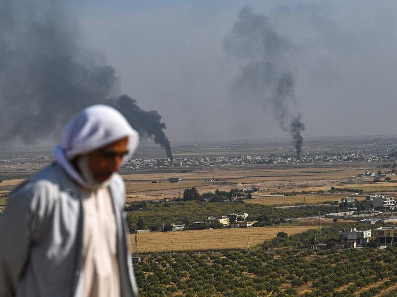 Turkey will not stop its operation against Kurdish militants in northern Syria, President Recep Tayyip Erdogan said Friday, dismissing what he called "threats" from other countries. Ozan KOSE / AFP