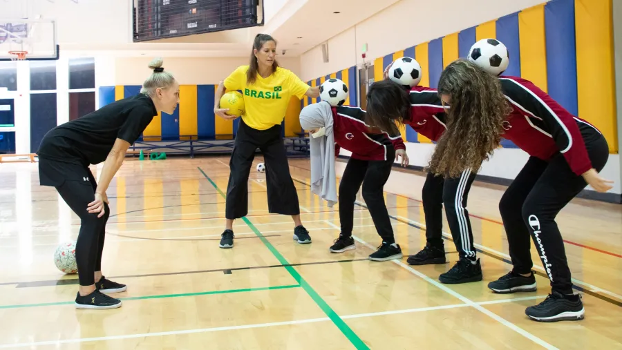QF Students Learn To Express Themselves – Using a Football