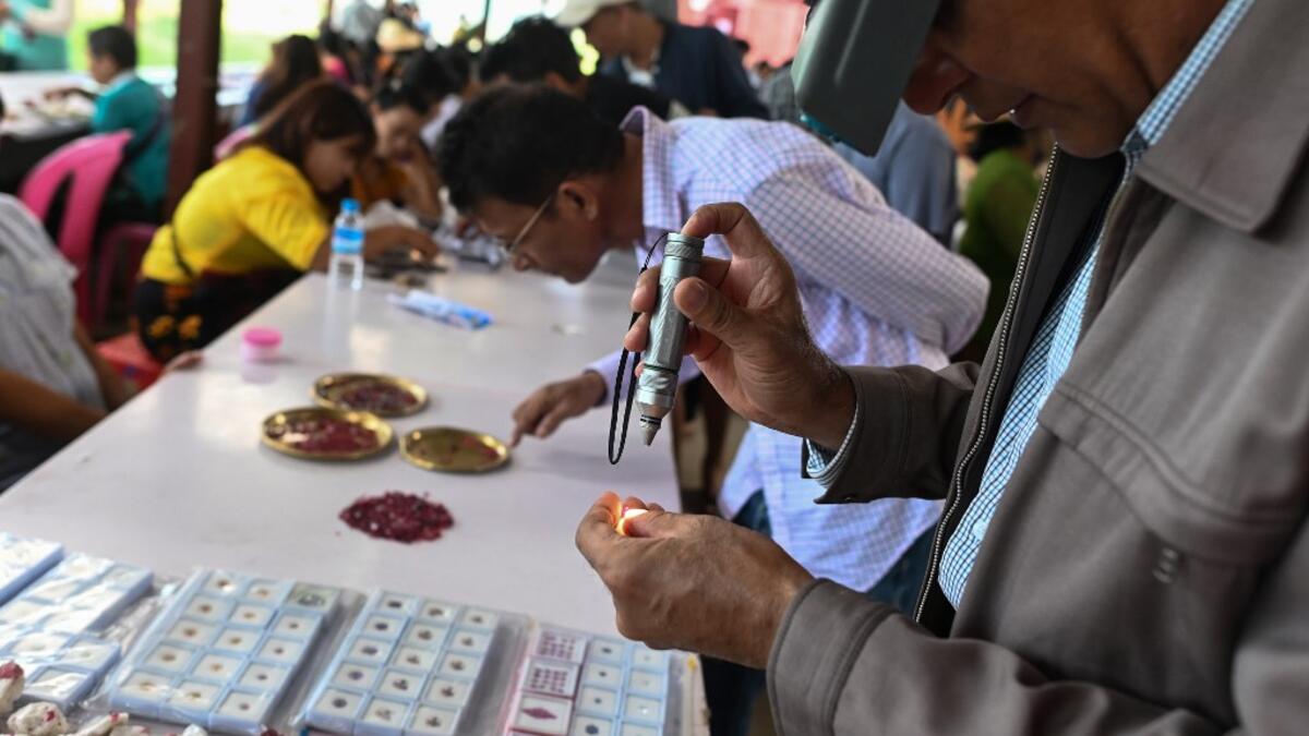 Burrowing deep underground, thousands of informal miners risk their lives to find gleaming red gems as a law change spurs opportunity in Myanmar's "land of rubies". Ye Aung THU / AFP