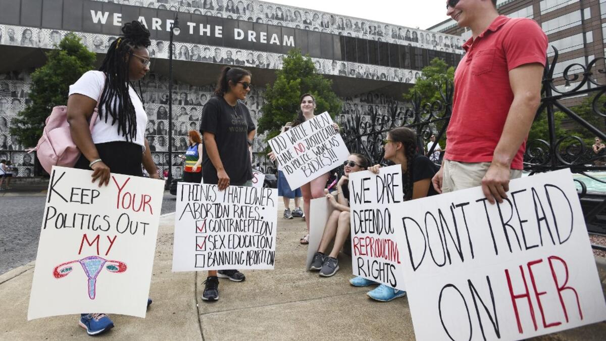Protestors prepare to participate in a rally against one of the nation's most restrictive bans on abortions on May 19, 2019 in Montgomery, Alabama. Julie Bennett/Getty Images/AFP