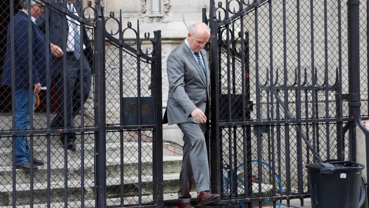 French Army General Jean-Louis Georgelin, in charge of Notre-Dame Cathedral's reconstruction (R) leaves after taking part in the first mass of cathedral on June 15, 2019, in Paris, two months after the April 15 devastating fire. Zakaria ABDELKAFI / AFP