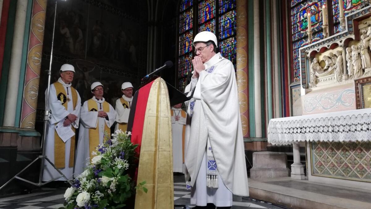 The Archbishop of Paris Michel Aupetit leads the first mass in a side chapel two months to the day after a devastating fire engulfed the Notre-Dame de Paris cathedral on June 15, 2019, in Paris. Karine PERRET / POOL / AFP