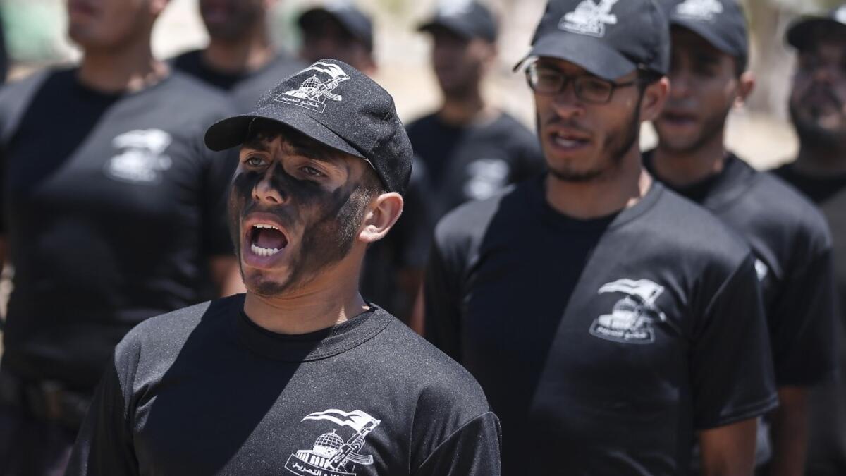 Palestinian military cadets take part in a training session organised by Hamas' military wing, the Ezzedin al-Qassam Brigades, in Gaza City on July 20, 2019.  MAHMUD HAMS / AFP