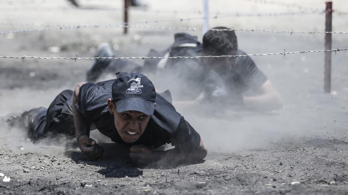 Palestinian military cadets take part in a training session organised by Hamas' military wing, the Ezzedin al-Qassam Brigades, in Gaza City on July 20, 2019.  MAHMUD HAMS / AFP