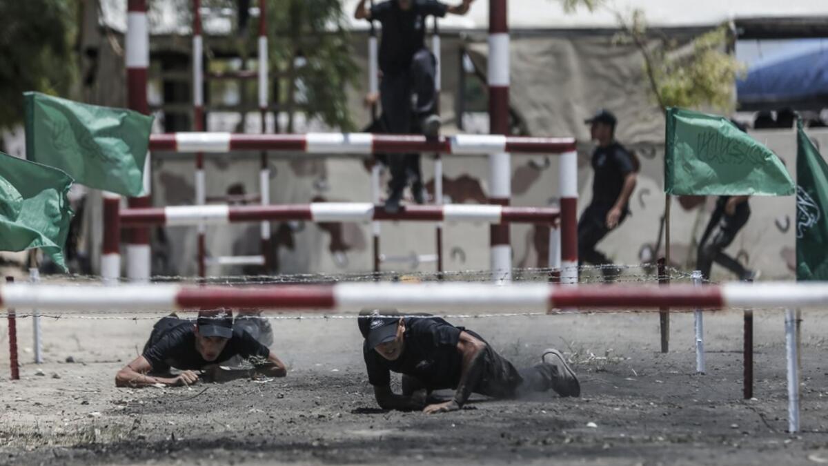 Palestinian military cadets take part in a training session organised by Hamas' military wing, the Ezzedin al-Qassam Brigades, in Gaza City on July 20, 2019.  MAHMUD HAMS / AFP