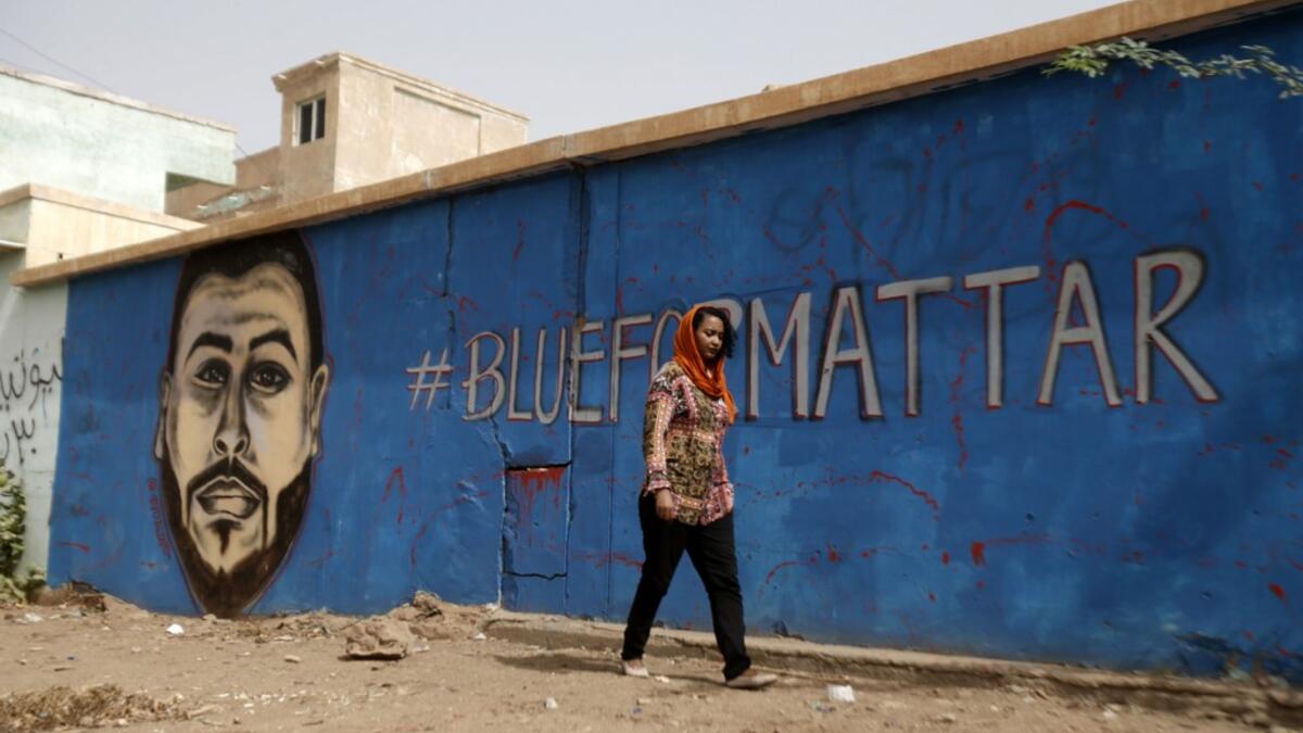Mattar was among dozens killed in the June 3 raid on a protest camp outside the military headquarters. The colourful graffiti is part of a campaign to draw faces of protesters killed on June 3 and during the months-long protest movement against now ousted leader Omar al-Bashir on the walls of their family homes.  ASHRAF SHAZLY / AFP