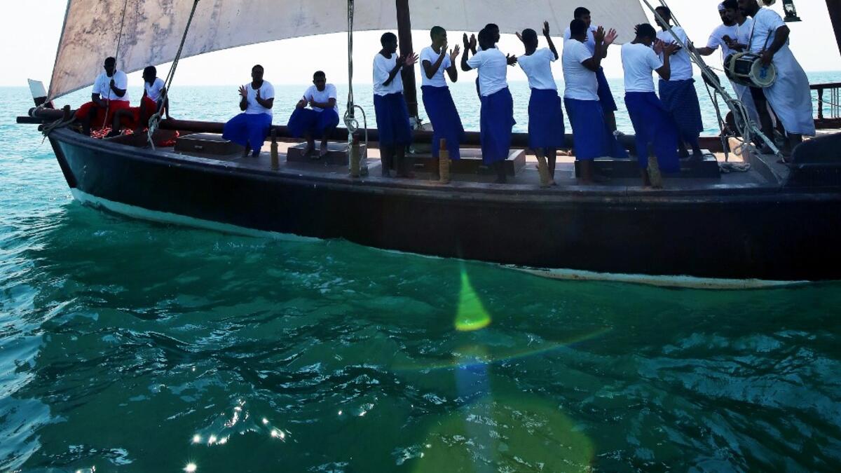 A Kuwaiti diver searches for shells containing pearls during the annual pearl diving season on July 30, 2019 off the coast of the port city of Khairan, 100 kms (62miles) south of Kuwait City Yasser Al-Zayyat / AFP