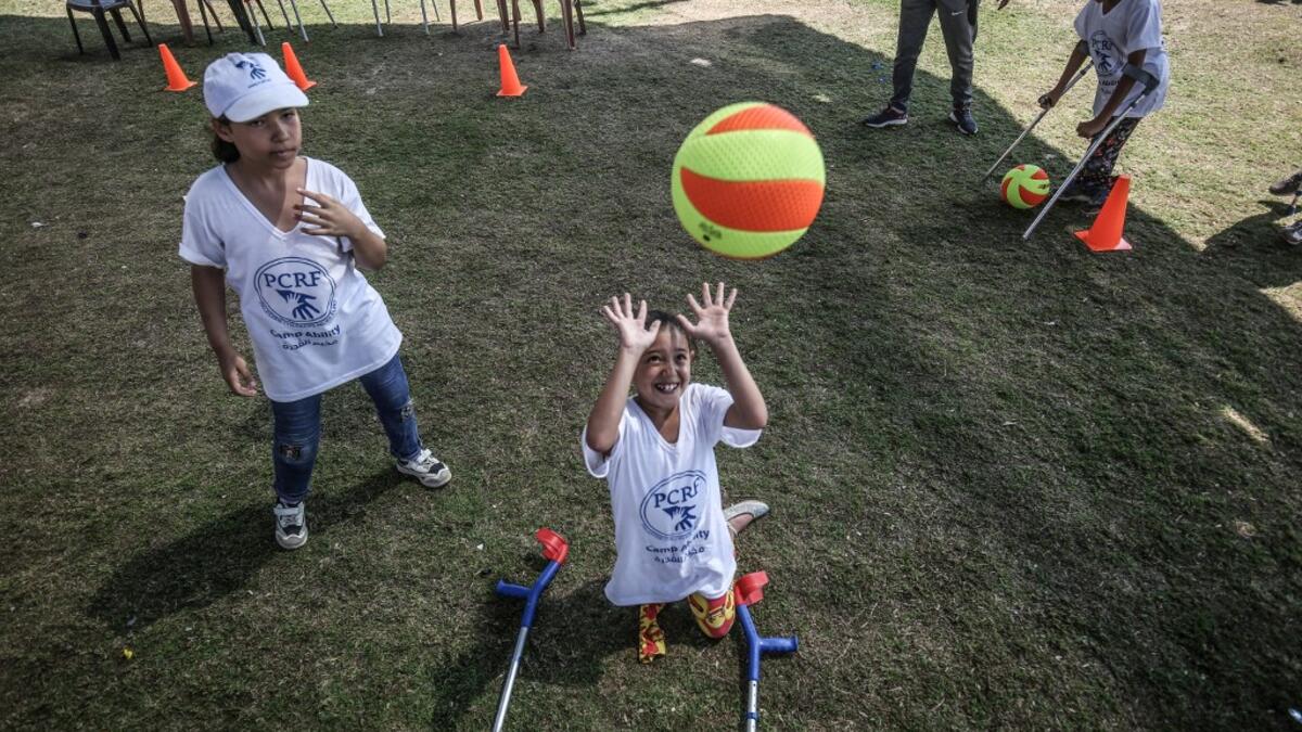 Palestinian amputee children play during a summer camp origanized by the Palestinian Children's Relief Fund (PCRF) in the town of Khan Yunis in the southern Gaza strip on August 3, 2019. SAID KHATIB / AFP
