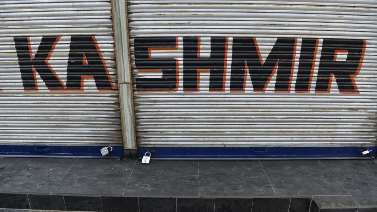 A closed shop is pictured during curfew in Srinagar Sajjad HUSSAIN / AFP