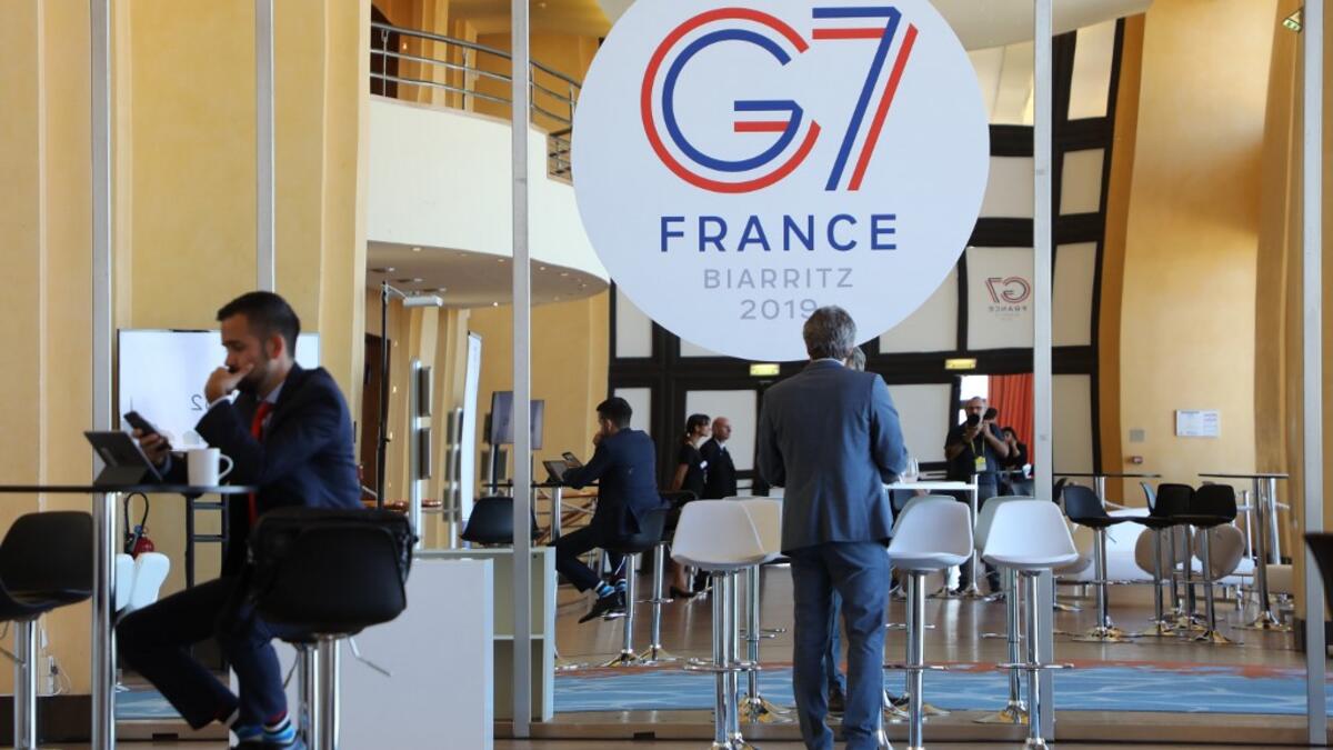 People work in the advanced press centre in the Casino of Biarritz, south-west France on August 24, 2019. ludovic MARIN / AFP