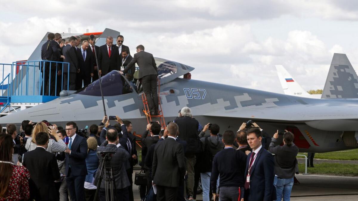 Russian President Vladimir Putin and his Turkish counterpart Recep Tayyip Erdogan inspect Sukhoi Su-57 fifth-generation fighter during the MAKS-2019 International Aviation and Space Salon opening ceremony in Zhukovsky outside Moscow on August 27, 2019.  Maxim SHIPENKOV / POOL / AFP