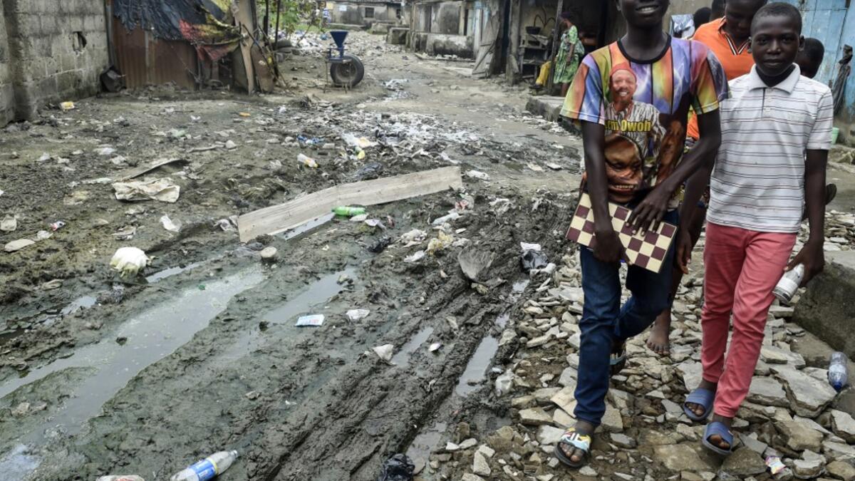 While dozens of matches are played simultaneously, participants, some as young as three years old, practice this brain game often considered out of reach for the poor populations of Africa's most populous country. PIUS UTOMI EKPEI / AFP