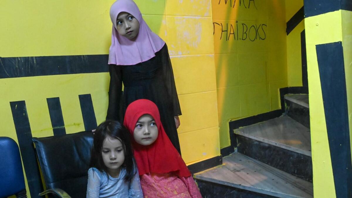 In this photograph taken on August 29, 2019, girls from the Uighur minority attend a boxing training session in a boxing academy in Istanbul. BULENT KILIC / AFP