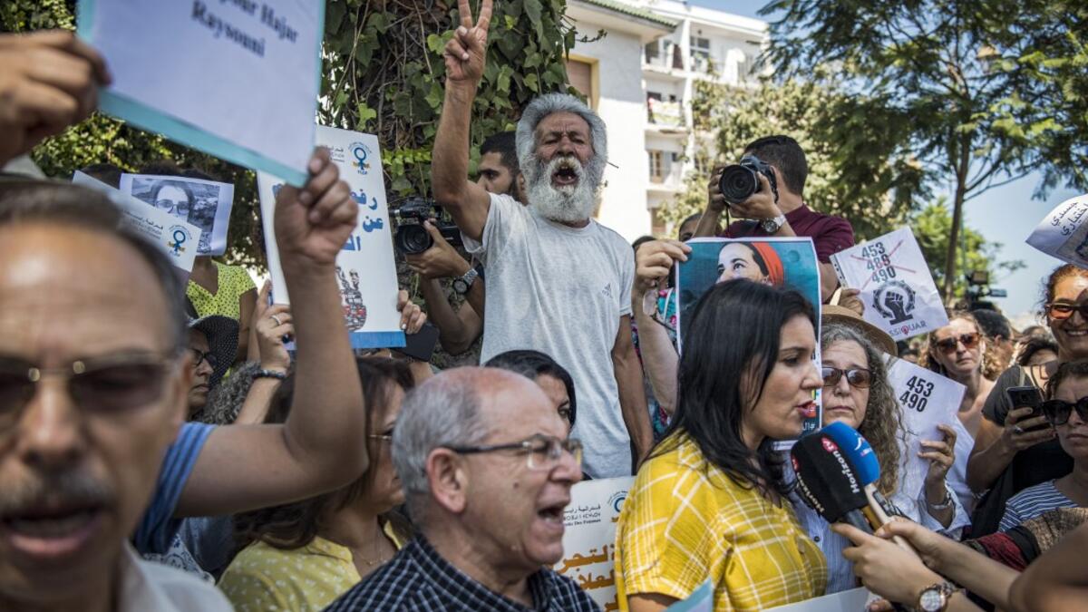 Demonstrators chant slogans and speak to the media as they gather outside a courthouse holding the trial of Hajar Raissouni, a Moroccan journalist of the daily newspaper Akhbar El-Youm, on charges of abortion, in the capital Rabat on September 9, 2019. FADEL SENNA / AFP