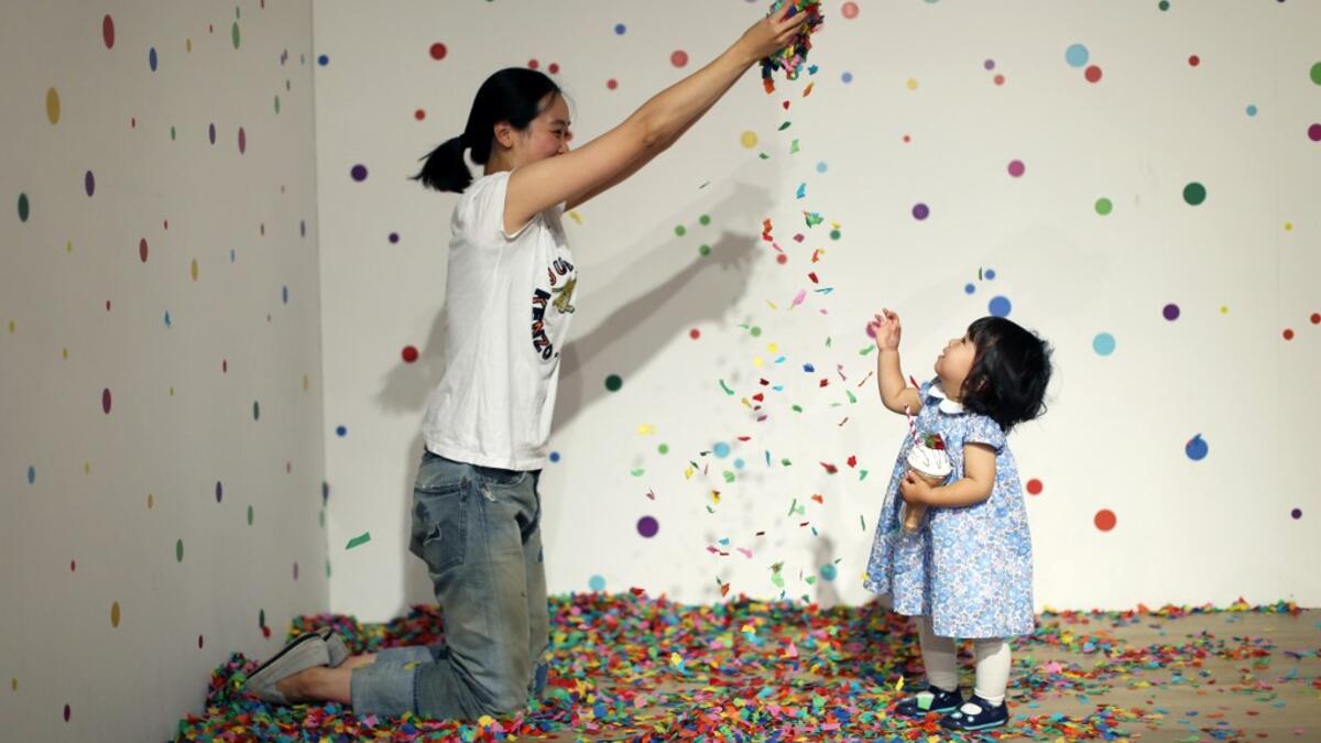 Visitors take and pose for "selfie" photographs at The Selfie Factory in Westfield London shopping centre in west London on September 11, 2019. ISABEL INFANTES / AFP