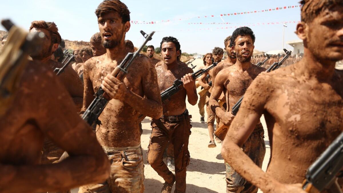 Turkish-backed fighters from al-Mutasim Brigade take part in a training at a camp near the Syrian town of Marea in the northern Aleppo district, on September 12, 2019. Nazeer Al-khatib / AFP