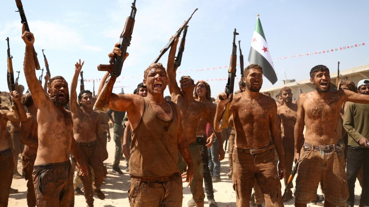 Syrian Turkish-backed fighters from al-Mutasim Brigade take part in a training at a camp near the town of Marea in Syria's northern Aleppo district, on September 12, 2019. Nazeer Al-khatib / AFP