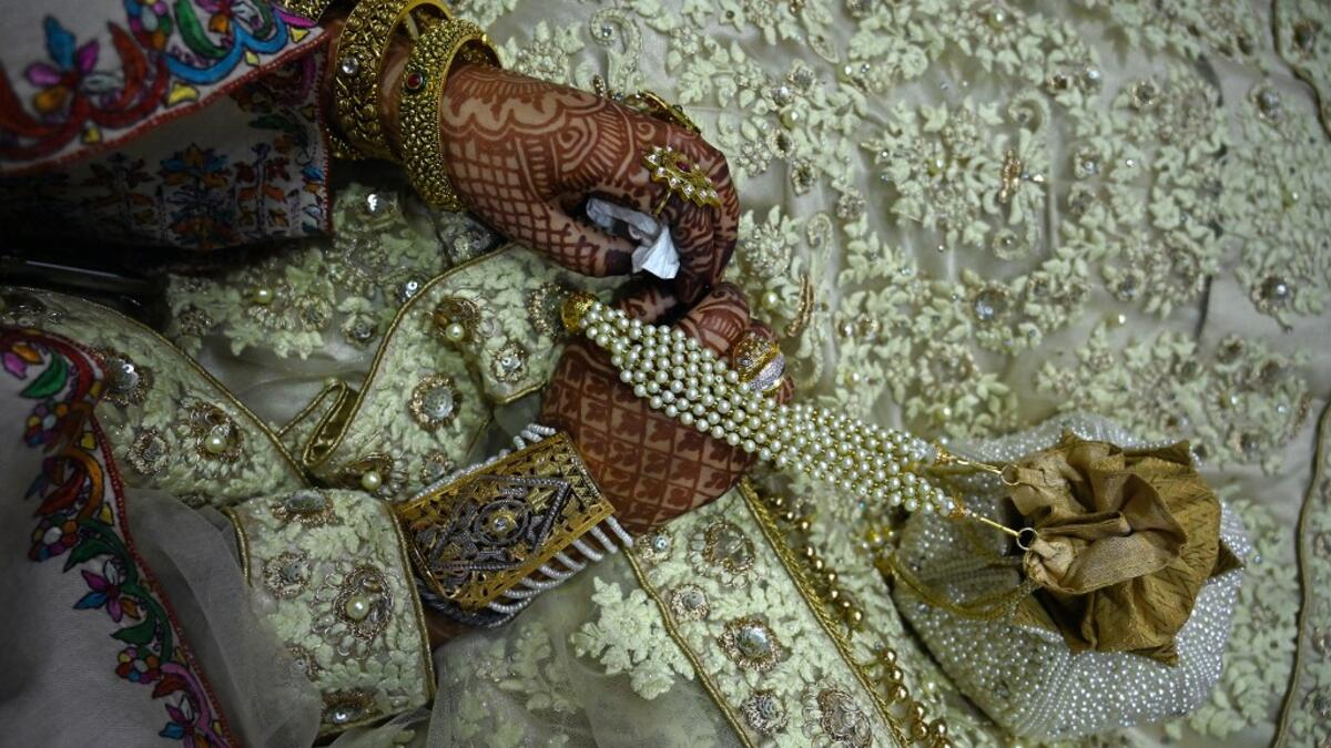 In this photo taken on September 15, 2019, a bride sits in her new husband's home following their marriage in Kashmir's Baramulla district, north of Srinagar. TAUSEEF MUSTAFA / AFP