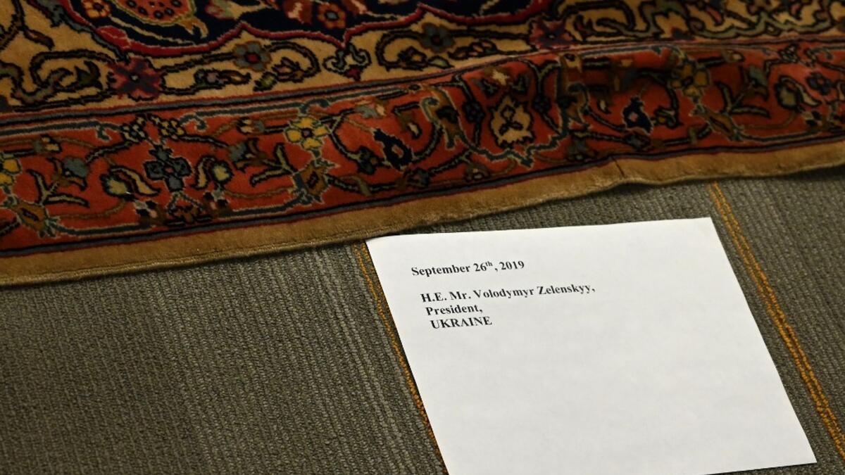 A place card is seen on the carpet for a photo op with Ukraine President Volodymyr Zelensky and the UN Secretary General António Guterres during the 74th Session of the General Assembly on September 26, 2019 in New York. TIMOTHY A. CLARY / AFP