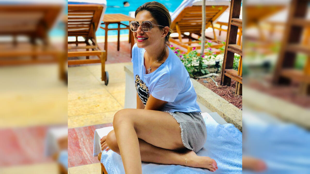 Menna enjoying her time by the pool side source @manoushafadali instagram