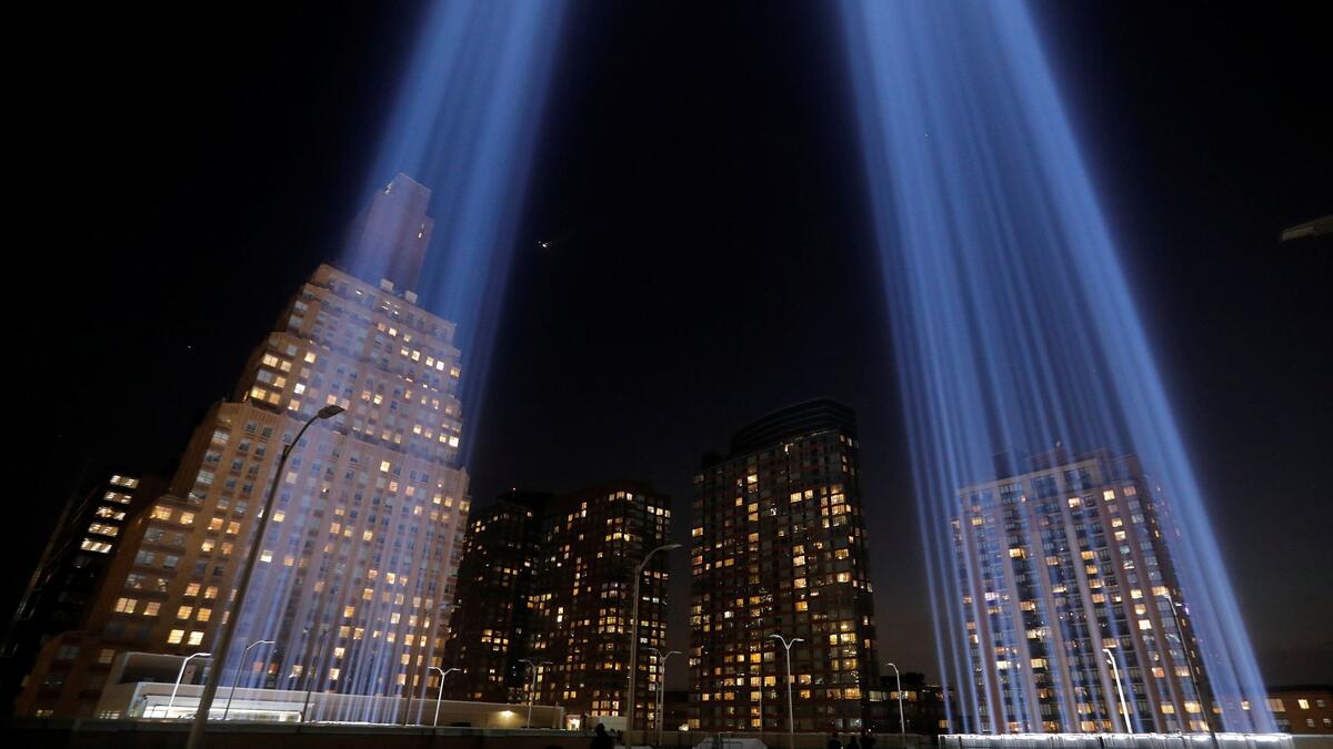 People look toward the Tribute in Light, lit up to commemorate the 18th anniversary of the September 11, 2001 attacks in New York, on Tuesday (Twitter)