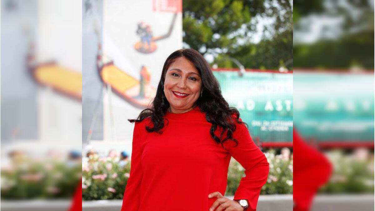 Saudi director Haifa Al Mansour wore a red dress by Jaeger-LeCoultre