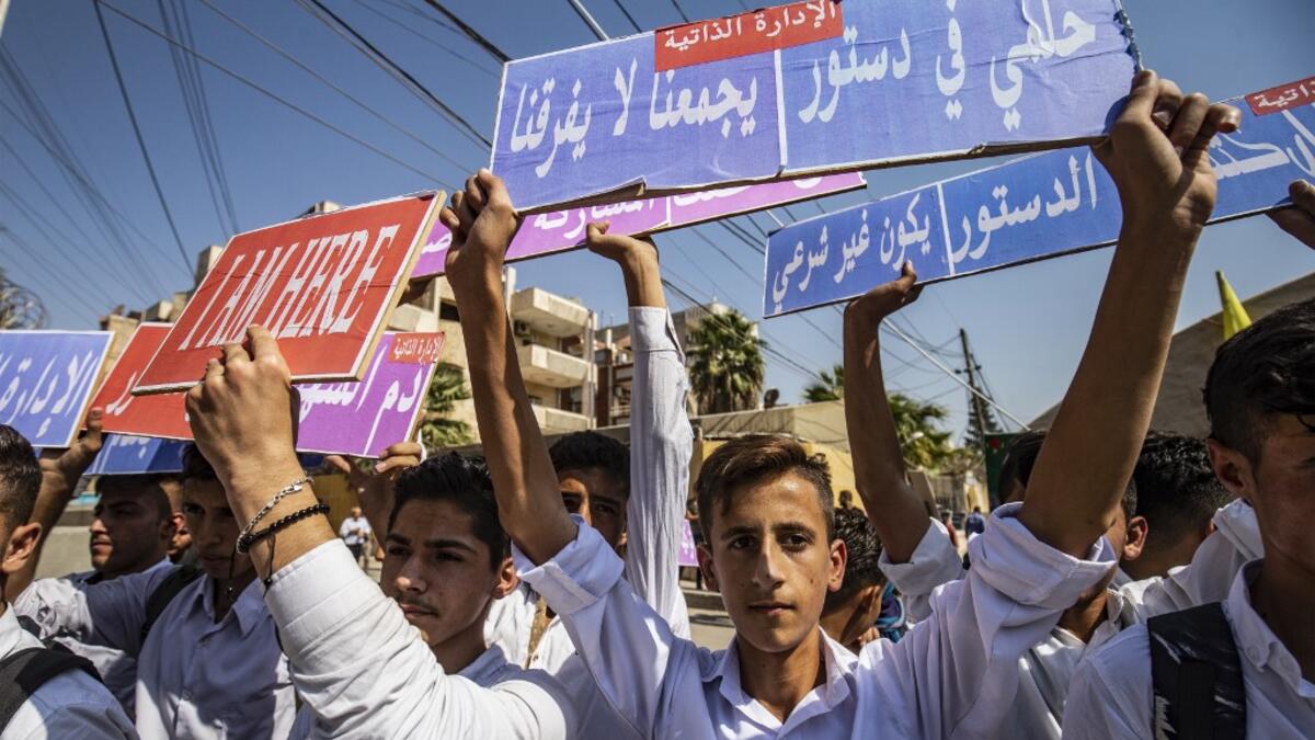 Syrian Kurds demonstrate in front of the United Nations offices in the Kurdish-majority city of Qamishli in northeast Syria on October 2, 2019 over their exclusion from the UN-backed constitutional committee. Delil SOULEIMAN / AFP