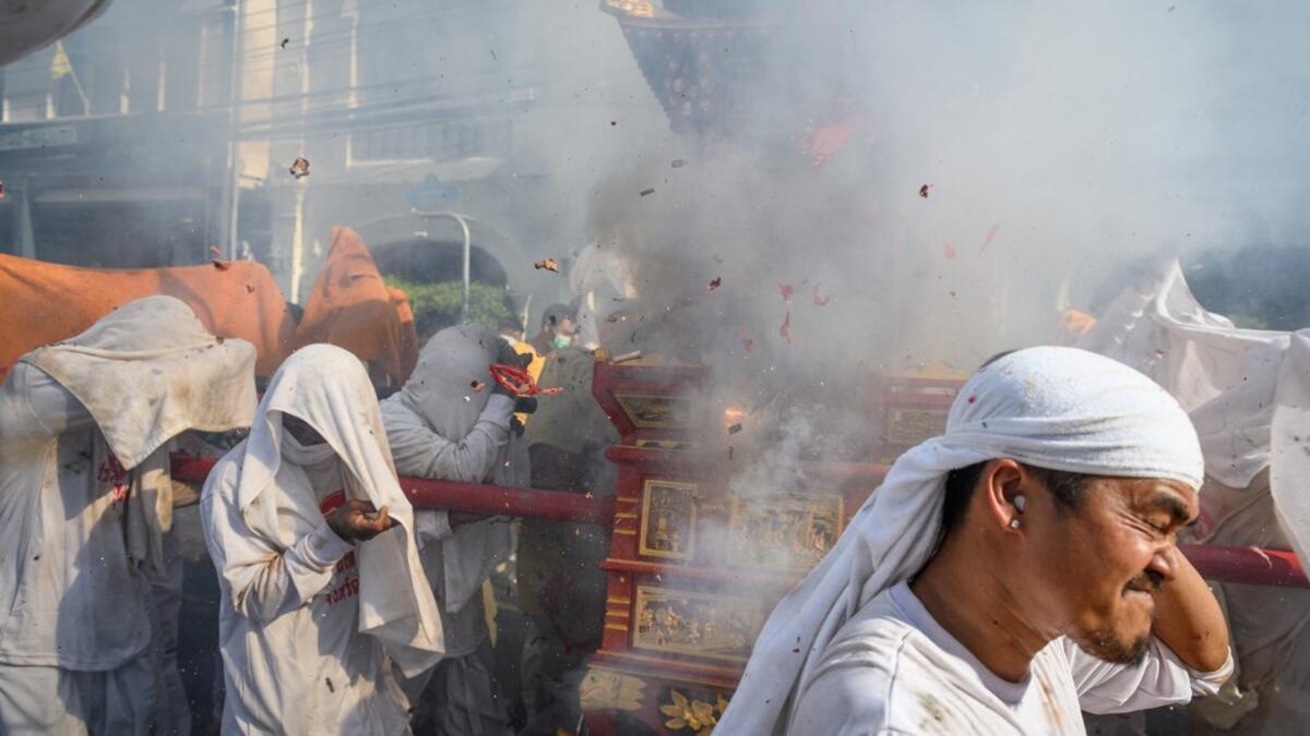 The festival begins on the first evening of the ninth lunar month and lasts for nine days, with many religious devotees slashing themselves with swords, piercing their cheeks with sharp objects and committing other painful acts to purify themselves, taking on the sins of the community. Mladen ANTONOV / AFP