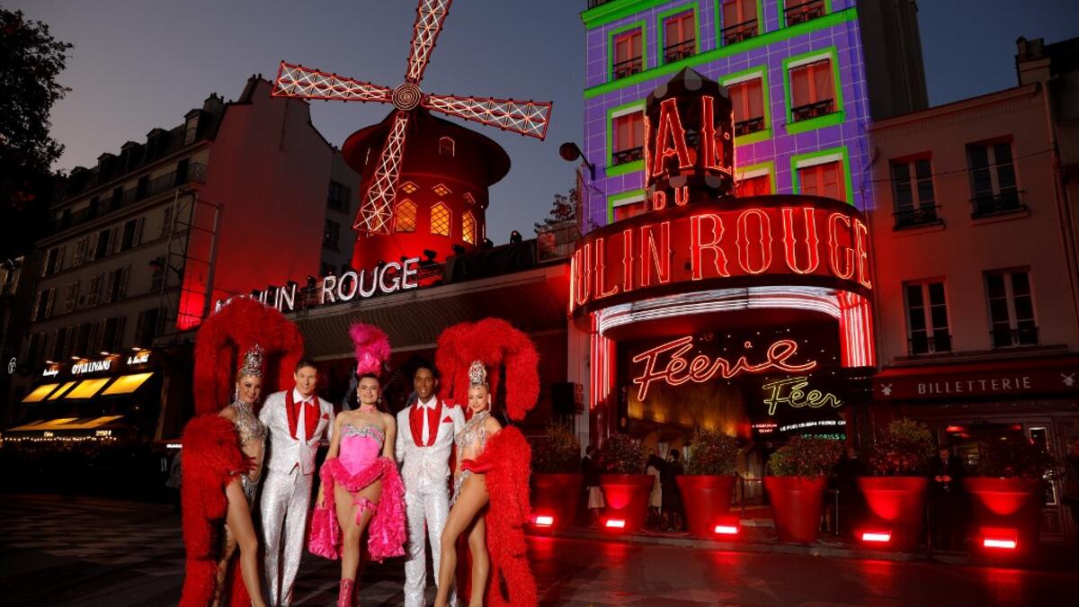 Moulin Rouge cabaret's French dancer Mathilde (2ndL) and Australian dancer Rhylee (2ndR) pose during the celebration of the 130th anniversary of the French oldest cabaret, on October 6, 2019 in Paris.  GEOFFROY VAN DER HASSELT / AFP