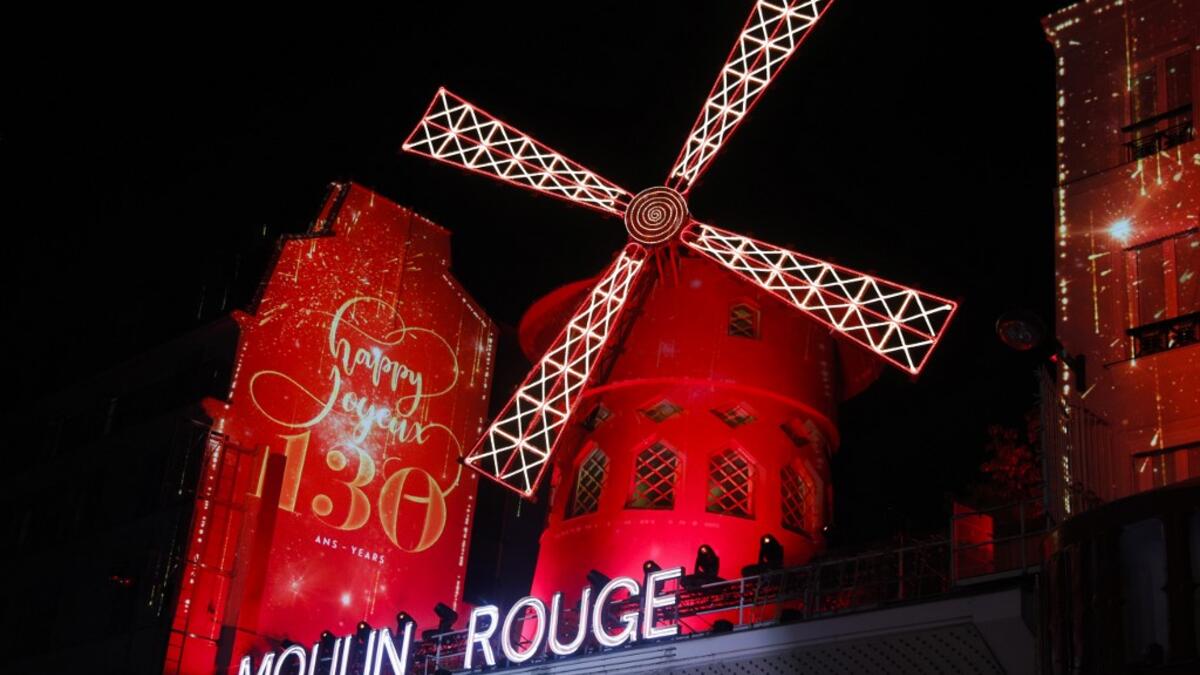This picture taken on October 6, 2019 shows Moulin Rouge logo during the celebration of the 130th anniversary of the French oldest cabaret, in Paris.  GEOFFROY VAN DER HASSELT / AFP